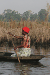 Woman Rowing Towards Mainland