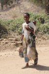Woman Carrying Child Back