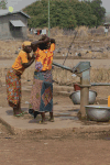 Women Pumping Water Community