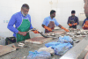 Fish Market Workers Cutting