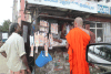 Monk Buying Lottery Ticket